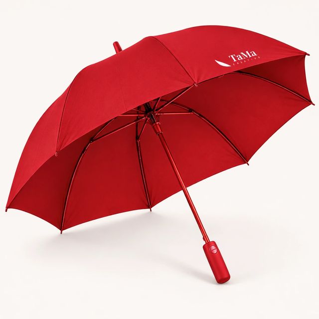 Guarda-chuva aberto, na cor vermelha, com a marca TaMa em um dos gomos.